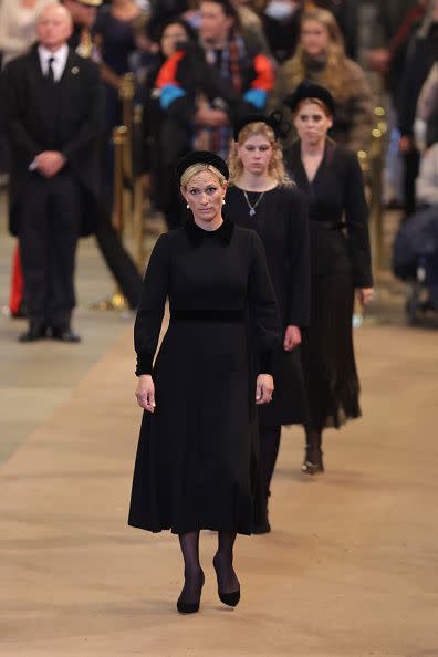 LONDON, ENGLAND - SEPTEMBER 17: Zara Tindall, Lady Louise Windsor and Princess Beatrice of York are seen during a vigil in honour of Queen Elizabeth II at Westminster Hall on September 17, 2022 in London, England. Queen Elizabeth II's grandchildren mount a family vigil over her coffin lying in state in Westminster Hall. Queen Elizabeth II died at Balmoral Castle in Scotland on September 8, 2022, and is succeeded by her eldest son, King Charles III. (Photo by Chris Jackson/Getty Images)