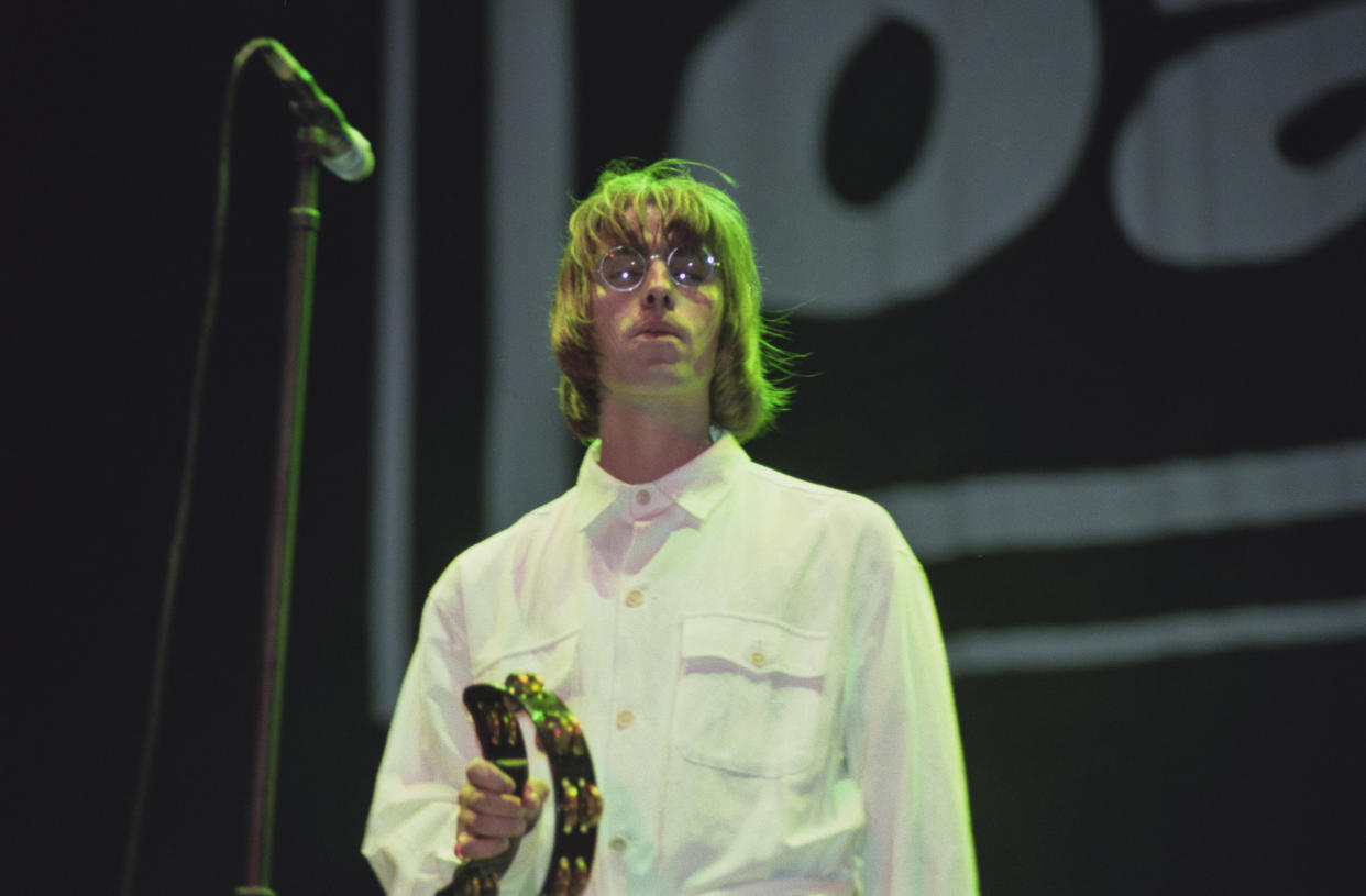 Singer Liam Gallagher performing with British rock group, Oasis, at Knebworth House, Hertfordshire, 10th August 1996. (Photo by Brian Rasic/Hulton Archive/Getty Images)