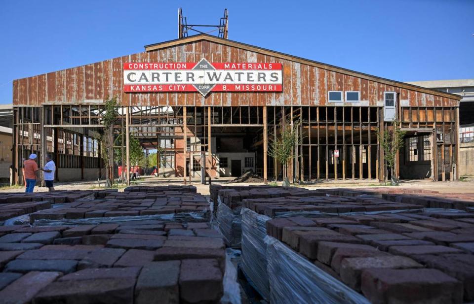 A neon Carter-Waters sign is mounted on the eastern side of what will house the indoor/outdoor Tailgate Beer Garden and Tailgate Park at Pennway Point.