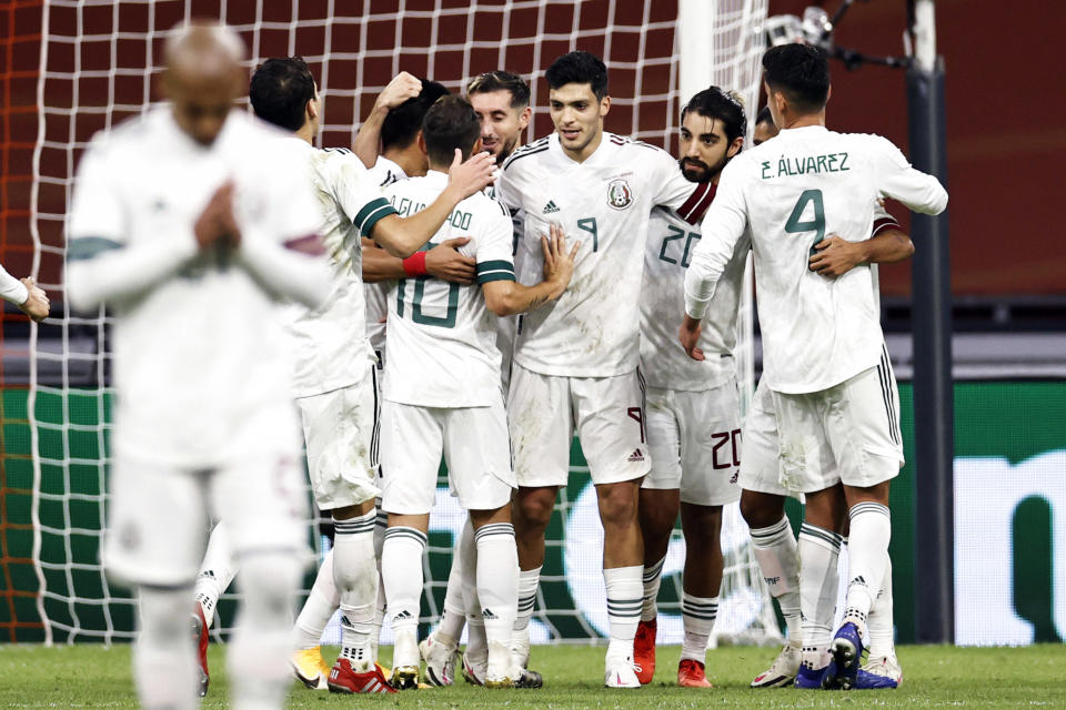 Mexico's players celebrate after scoring a goal during the friendly match between the Netherlands and Mexico at the Johan Cruyff Arena on October 7, 2020, in Amsterdam. (Photo by MAURICE VAN STEEN / ANP / AFP) / Netherlands OUT (Photo by MAURICE VAN STEEN/ANP/AFP via Getty Images)