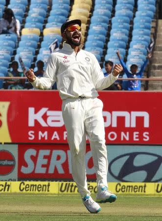 Cricket - India v England - First Test cricket match - Saurashtra Cricket Association Stadium, Rajkot - 9/11/16. India's captain Virat Kohli celebrates the dismissal of England's Haseeb Hameed. REUTERS/Amit Dave