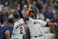 Houston Astros' Martin Maldonado (15) celebrates with Alex Bregman (2) after hitting a three-run home run against the Texas Rangers during the second inning of a baseball game Thursday, Aug. 11, 2022, in Houston. (AP Photo/David J. Phillip)