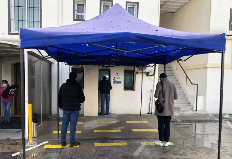 People wait to get tested for the coronavirus disease (COVID-19) at Saint George Hospital University Medical center, in Beirut