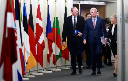 Ireland's Foreign and Trade Minister Simon Coveney and European Union's chief Brexit negotiator Michel Barnier arrive for a meeting in Brussels, Belgium, March 19, 2018. Olivier Hoslet/Pool via Reuters
