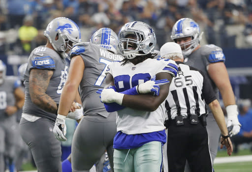 Demarcus Lawrence is playing on a franchise tag that pays him a base salary of $17.1 million. (AP) 