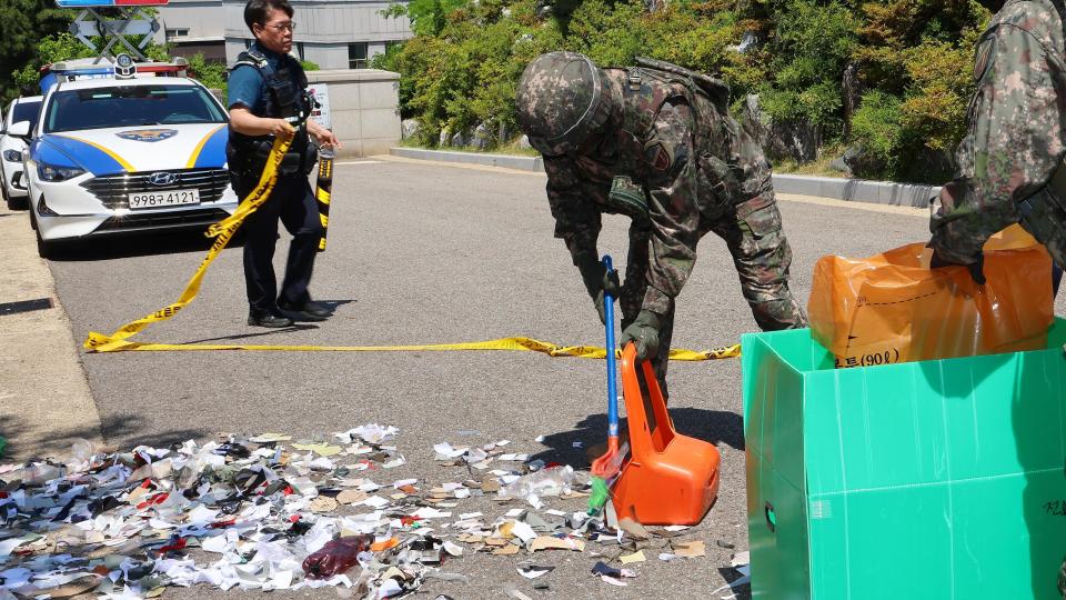 Military personnel collect the debris of balloons sent by North Korea in Incheon, west of Seoul, South Korea, 02 June 2024.