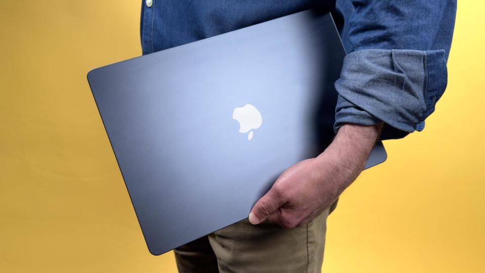 MacBook Air 15-inch M3 closed in hand