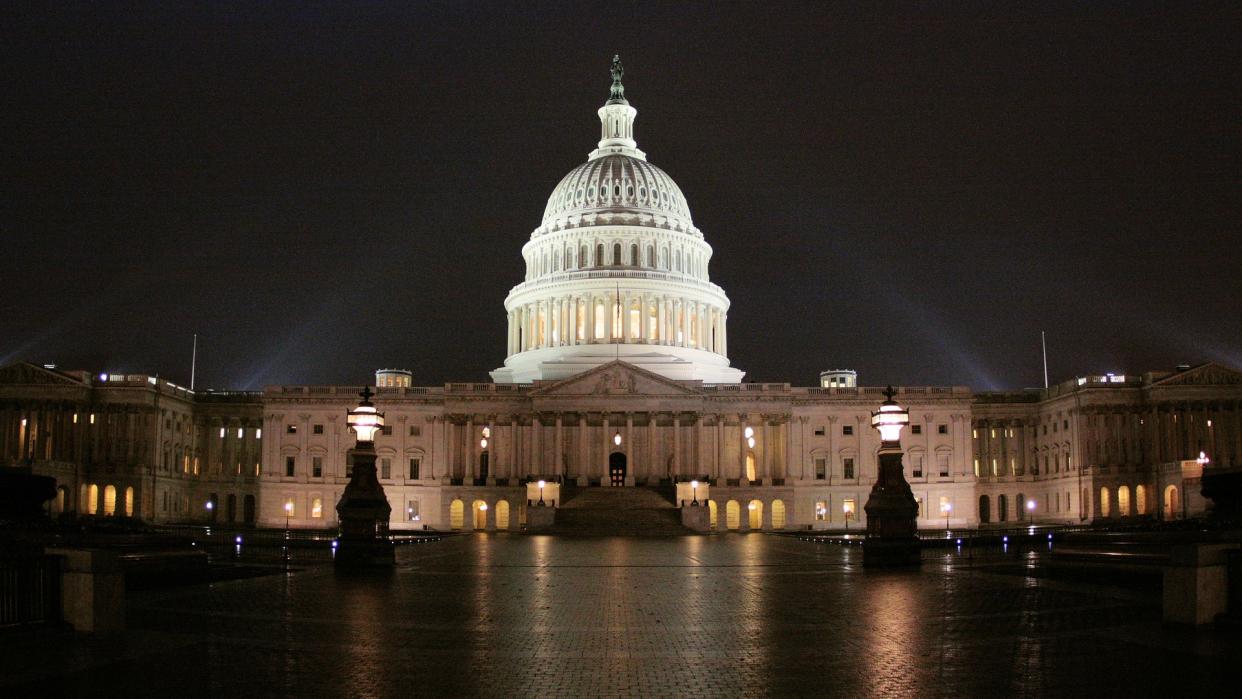  The us capitol building is lit up at night. 