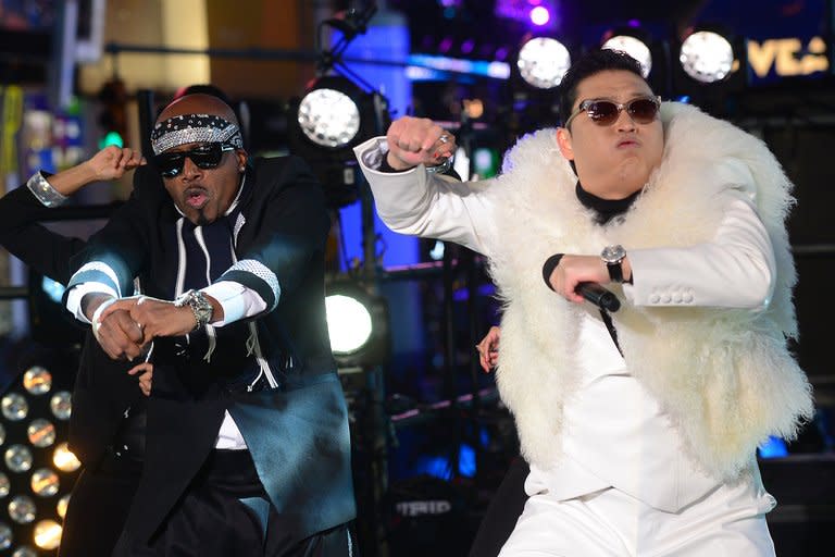 South Korean singer Psy (right) performs with US singer MC Hammer during New Year's Eve celebrations in Times Square in New York on December 31, 2012. China's hugely popular Lunar New Year television galas aim to woo even more viewers this year with foreign megastars including Celine Dion and "Gangnam Style" pop sensation Psy, state media said Thursday