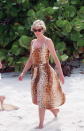 <p>You can barely escape the wrath of animal print this season, with leopard and zebra ruling supreme. Here, Diana wears some leopard print on the beach in the Necker Islands in 1990 – and how effortless does she make it look? (Getty Images)</p> 