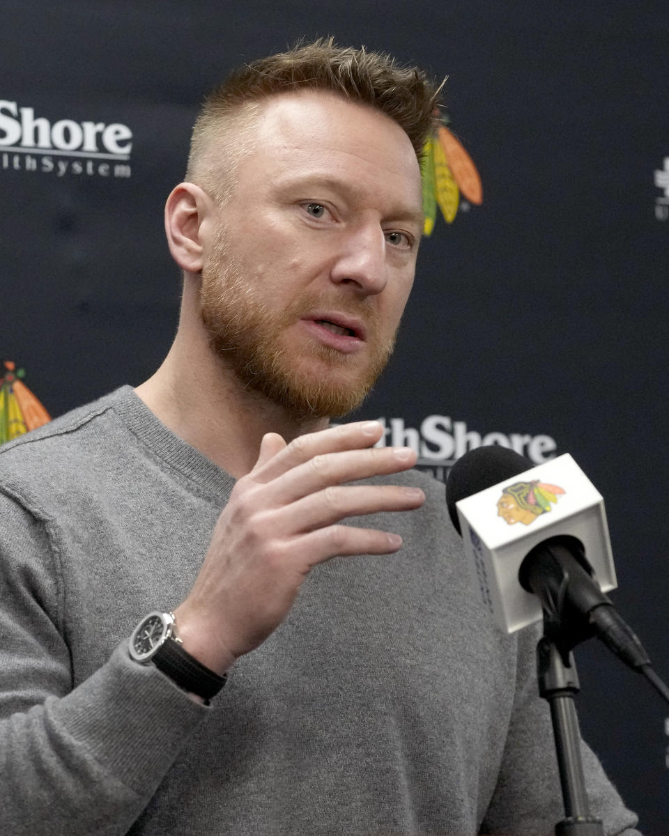 Former Chicago Blackhawks great Marian Hossa responds to a reporter's question before an NHL hockey game between the Blackhawks and the St. Louis Blues on Wednesday, Nov. 16, 2022, in Chicago. The Blackhawks are planning to retire Hossa's No. 81 sweater before Sunday's game against the Pittsburgh Penguins. (AP Photo/Charles Rex Arbogast)