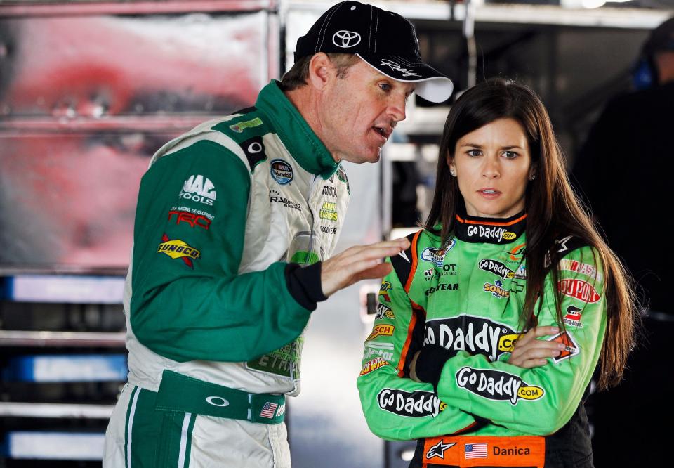 HOMESTEAD, FL - NOVEMBER 16: (L-R) Kenny Wallace, driver of the #99 Toyota Toyota, talks with Danica Patrick, driver of the #7 GoDaddy.com Chevrolet, during practice for the NASCAR Nationwide Series Ford EcoBoost 300 at Homestead-Miami Speedway on November 16, 2012 in Homestead, Florida. (Photo by Tom Pennington/Getty Images)