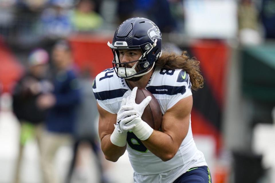 Seattle Seahawks tight end Colby Parkinson (84) warms up before a game against the Cincinnati Bengals.