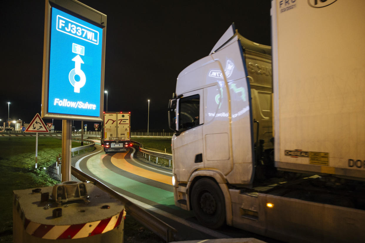 A truck from Britain drives over green and orange lines on the road that is part of the new 'smart border' customs infrastructure to enter France at the Eurotunnel terminal in Coquelles, northern France. Photo: Lewis Joly/AP