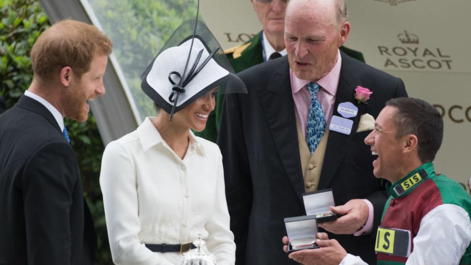 Meghan, Duchess of Sussex and Prince Harry, Duke of Sussex present a trophy at Royal Ascot Day 1 at Ascot Racecourse on June 19, 2018