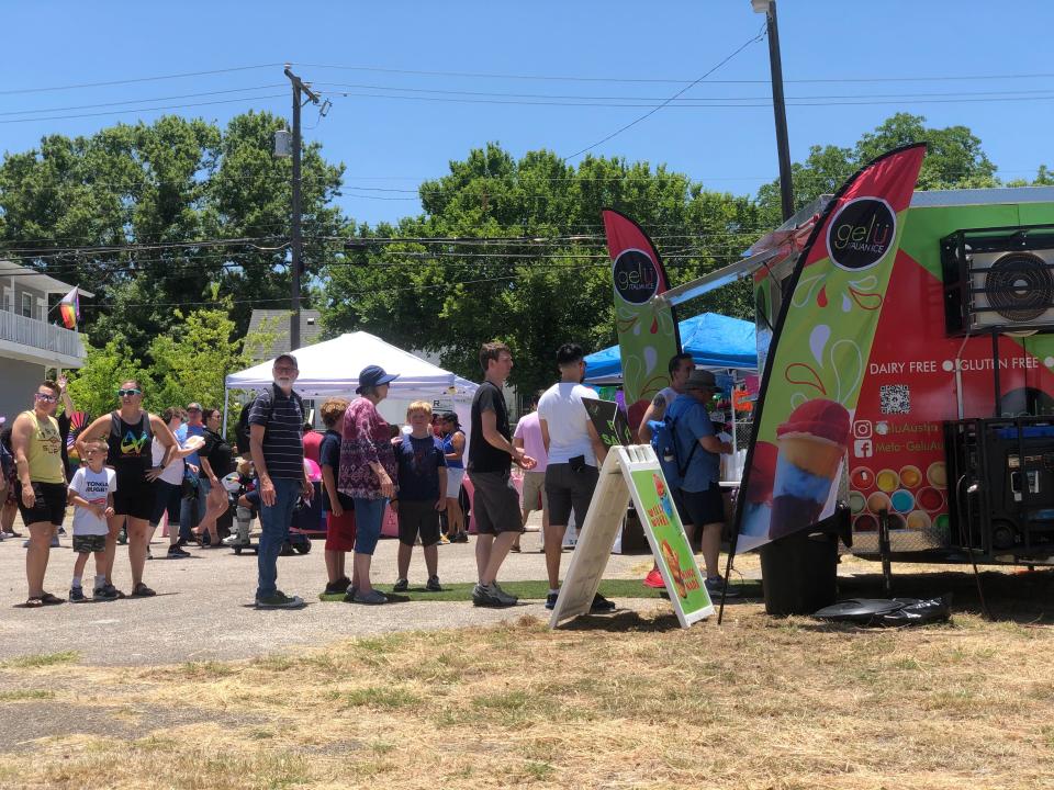 Attendees wait in line to quench their thirst at the first Gay Pride event in Pflugerville.