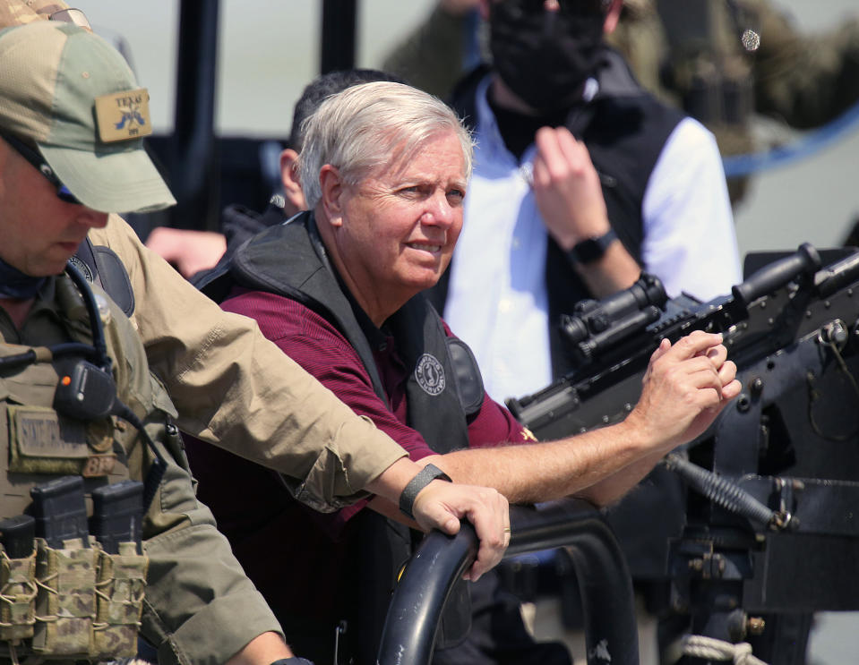 U.S. Senator Lindsey Graham, R-S.C., looks around as the boat docks after a boat tour along with Texas State Troopers before a group of U.S. Senators hold a press conference at Anzalduas Park on Friday, March 26, 2021, in Mission, Texas. Sen. Ted Cruz led a delegation of lawmakers to the border area Friday. He tweeted out photos of dozens of minors, wrapped in foil-like space blankets, lying on the floor of crowded Border Patrol facilities.(Joel Martinez/The Monitor via AP)