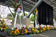 Flower bouquets are displayed as a memorial to victim's of Sunday's shooting as survivors and church leaders join in prayer and thank community members for their support nearly a week after a deadly shooting at a Taiwanese American church congregation Saturday, May 21, 2022, in Laguna Woods, Calif. The community is reeling after the attack on a luncheon of the Irvine Taiwanese Presbyterian Church that killed one and wounded five. (AP Photo/Amy Taxin)