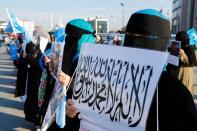 Ethnic Uyghur women take part in a protest against China