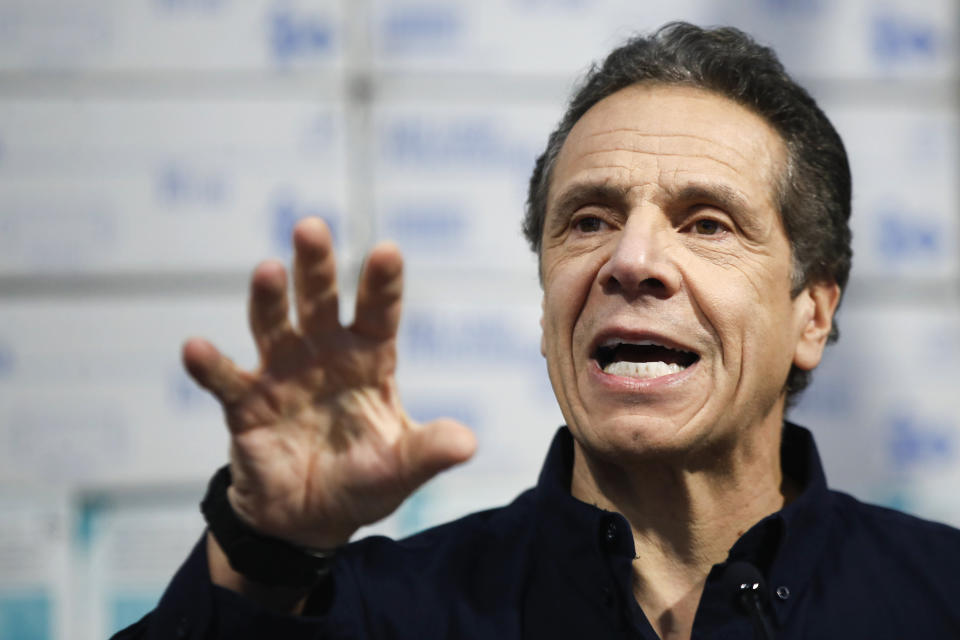 In this March 24, 2020 photo, New York Gov. Andrew Cuomo speaks during a news conference against a backdrop of medical supplies at the Jacob Javits Center that will house a temporary hospital in response to the COVID-19 outbreak in New York. Amid an unprecedented public health crisis, the nation’s governors are trying to get what they need from the federal government – and fast. But often that means navigating the disorienting politics of dealing with President Donald Trump. (AP Photo/John Minchillo)