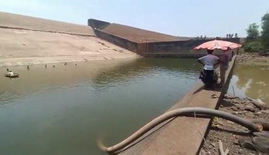 An image from video shared widely on social media shows the water being pumped out of Paralkot reservoir in central India's Chhattisgarh state, on the orders of state official Rajesh Vishwas, who dropped his phone into the body of water. 