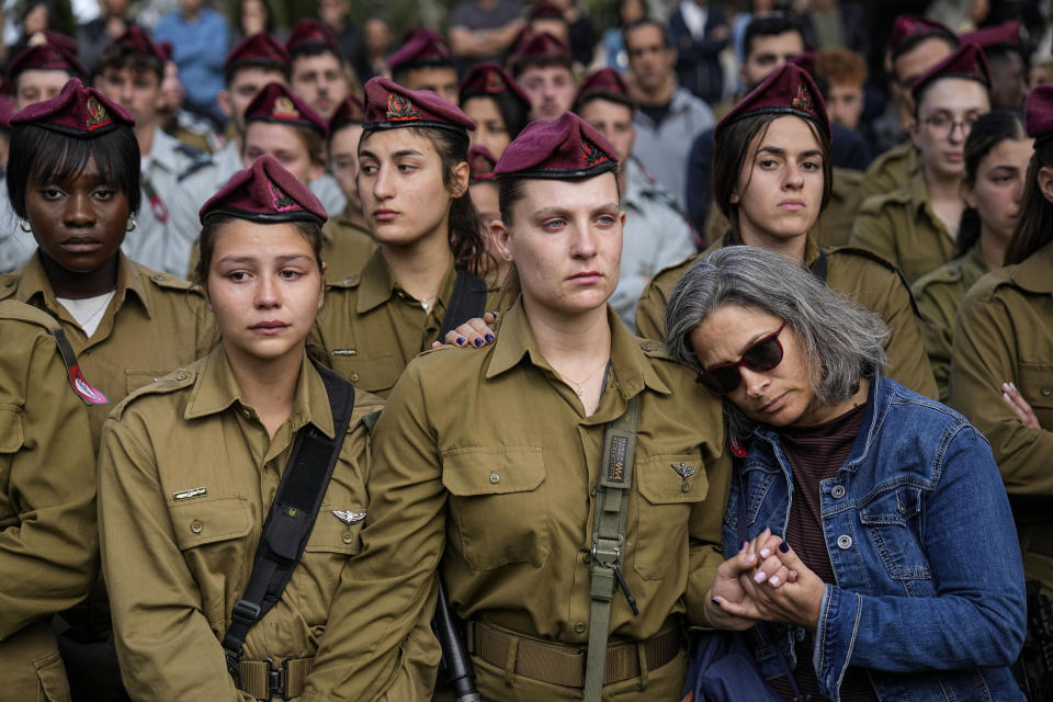 Israeli soldiers mourners in grief during the funeral of Israeli solider Staff sergeant David Sasson, in Netanya, Israel, Thursday, March 7, 2024. Sasson, 21, was killed during Israel's ground operation in the Gaza Strip, where the Israeli army has been battling Palestinian militants in the war ignited by Hamas' Oct. 7 attack into Israel. (AP Photo/Ariel Schalit)