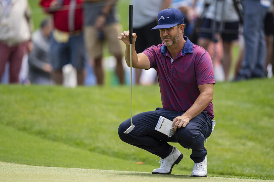 Scott Piercy lines up his putt on the first hole during the third round of the Wells Fargo Championship golf tournament at Quail Hollow on Saturday, May 8, 2021, in Charlotte, N.C. (AP Photo/Jacob Kupferman)