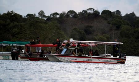 Rescuers search for victims after a tourist boat sanks with 150 passengers in the Guatape reservoir, Colombia, June 25, 2017. REUTERS/Fredy Builes