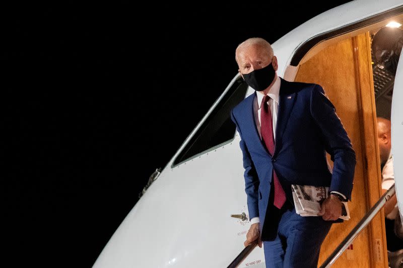 Democratic U.S. presidential nominee Joe Biden disembarks plane in New Castle, Delaware