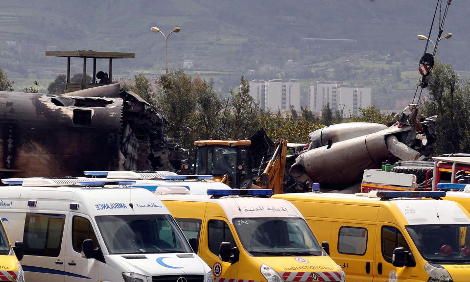 <p>Firefighters and civil security officers work at the scene of a fatal military plane crash in Boufarik, near the Algerian capital, Algiers, April 11, 2018. (Photo: Anis Belghoul/AP) </p>