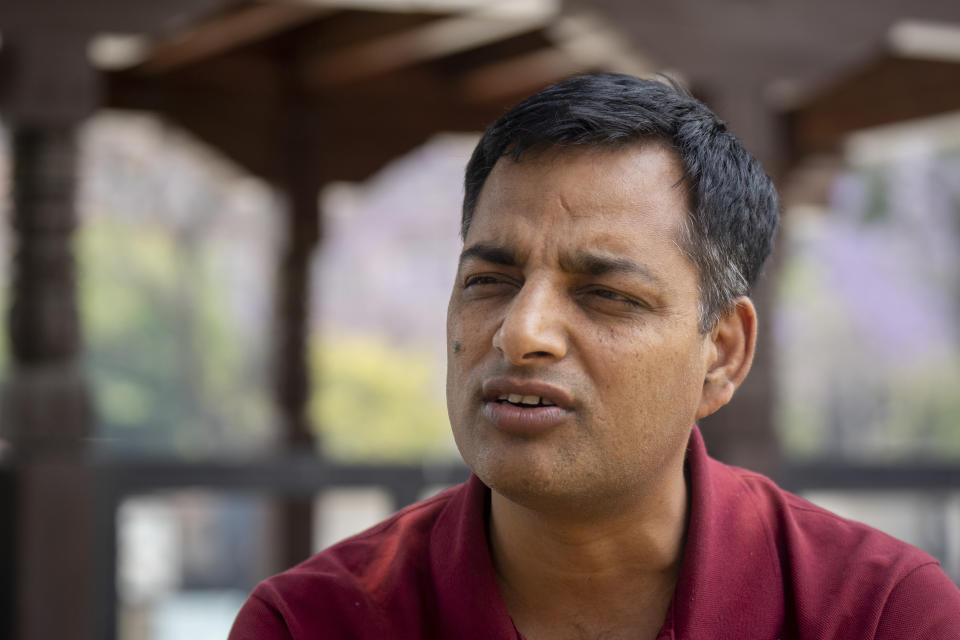 Sagar Mani Gnawali of the Nepal Electricity Authority speaks during an interview with the Associated Press in Kathmandu, Nepal, Thursday, April 25, 2024. Gnawali, who head the agency’s department in charge of Electric Vehicle Charging infrastructure Development, said Nepal now has 400 charging stations and the number is expected to double within a year. (AP Photo/Niranjan Shrestha)