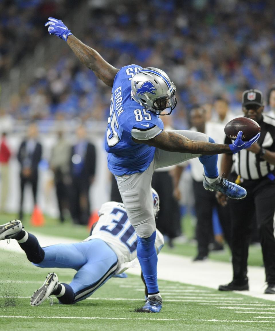 <p>Detroit Lions tight end Eric Ebron holds onto the ball after making a catch and leaping over Tennessee Titans cornerback Jason McCourty during the first half of an NFL football game, Sunday, Sept. 18, 2016, in Detroit. (AP Photo/Jose Juarez) </p>