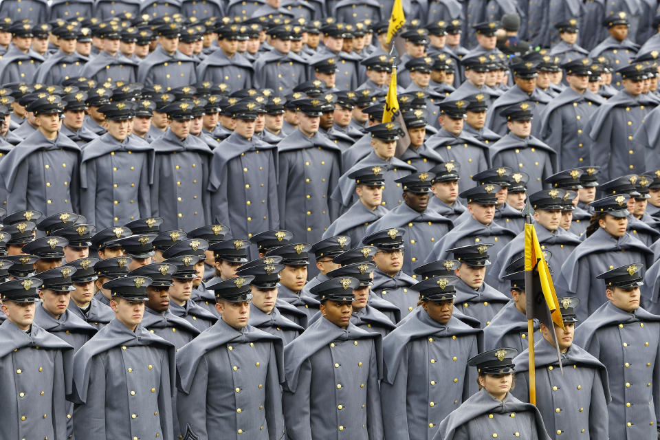 Army Cadets stand at attention on the field before an NCAA football game between the Navy Midshipmen and the Army Black Knights at Gillette Stadium Saturday, Dec. 9, 2023, in Foxborough, Mass. (AP Photo/Winslow Townson)