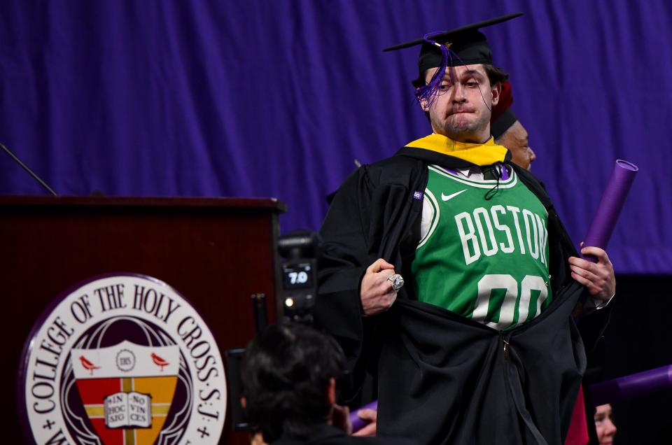 After receiving his diploma, Cristos Argys of Providence, R.I., reveals a Celtics fashion addition to his robe.