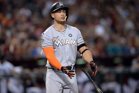 FILE PHOTO: Sep 22, 2017; Phoenix, AZ, USA; Miami Marlins right fielder Giancarlo Stanton (27) flips his bat after striking out against the Arizona Diamondbacks during the second inning at Chase Field. Joe Camporeale-USA TODAY Sports