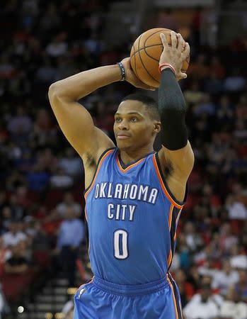 Nov 2, 2015; Houston, TX, USA; Oklahoma City Thunder guard Russell Westbrook (0) looks for an outlet pass against the Houston Rockets in the third quarter at Toyota Center. Rocket won 110 to 105. Mandatory Credit: Thomas B. Shea-USA TODAY Sports