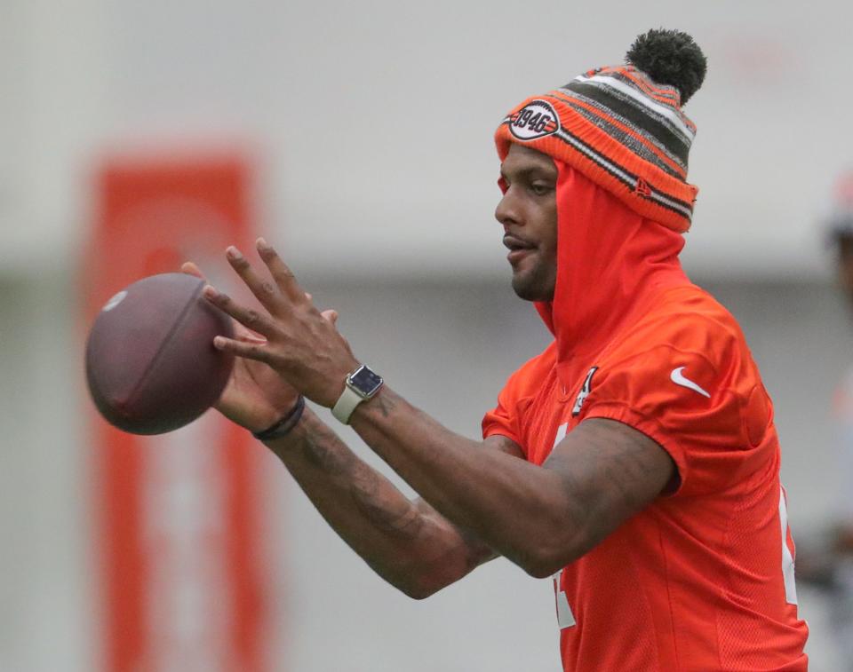 Cleveland Browns quarterback Deshaun Watson takes a snap during training camp on Wednesday, July 27, 2022 in Berea.