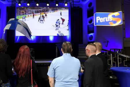 People watch the IIHF Ice Hockey World Championships final match between Canada and Finland during the European Parliament elections in Helsinki, Finland May 26, 2019. Lehtikuva/Vesa Moilanen/via REUTERS