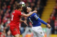 <p>Liverpool’s Lucas Leiva in action with Everton’s Ross Barkley </p>