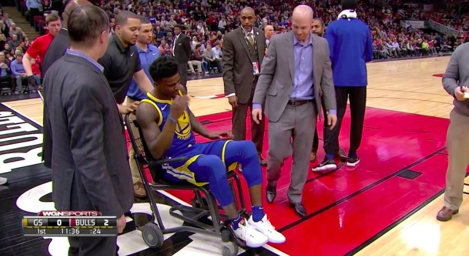 Warriors rookie Jordan Bell leaves the court at United Center in a wheelchair. (Screencap via NBA)