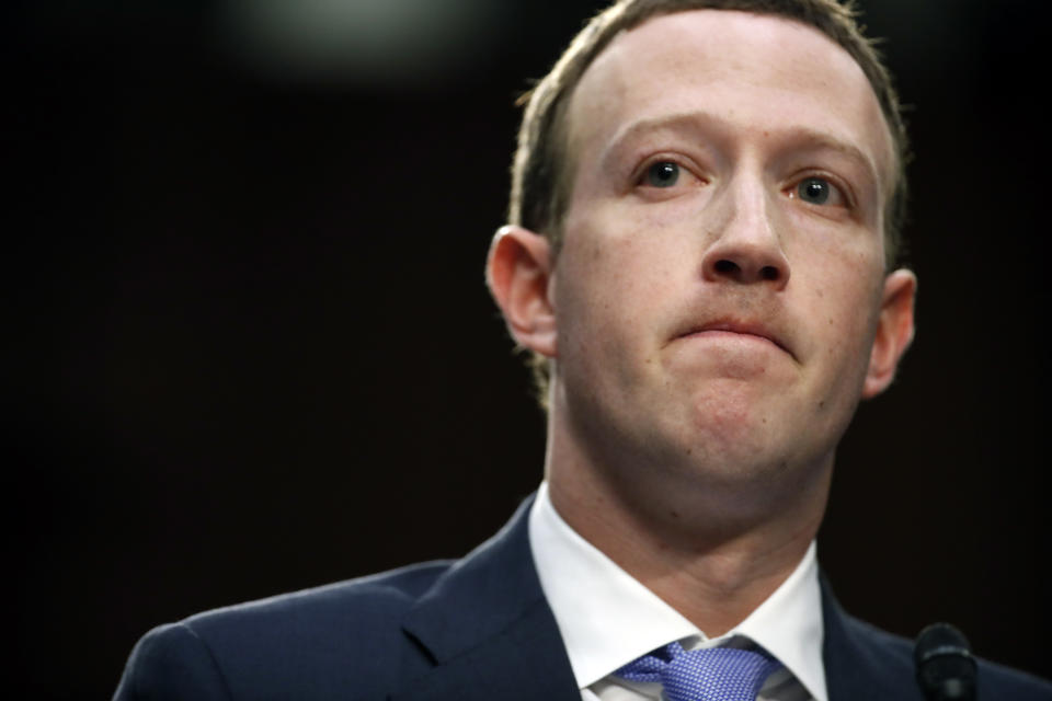 Facebook CEO Mark Zuckerberg pauses while speaking as he testifies before a joint hearing of the Commerce and Judiciary Committees on Capitol Hill in Washington, Tuesday, April 10, 2018, about the use of Facebook data to target American voters in the 2016 election. (AP Photo/Alex Brandon)