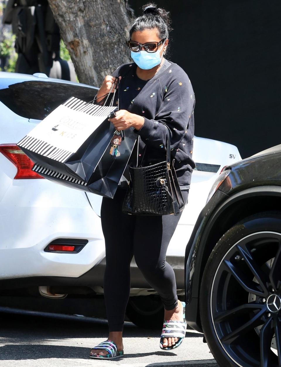 <p>Mindy Kaling heads to her car after a shopping trip at Couture Kids in West Hollywood on Wednesday.</p>