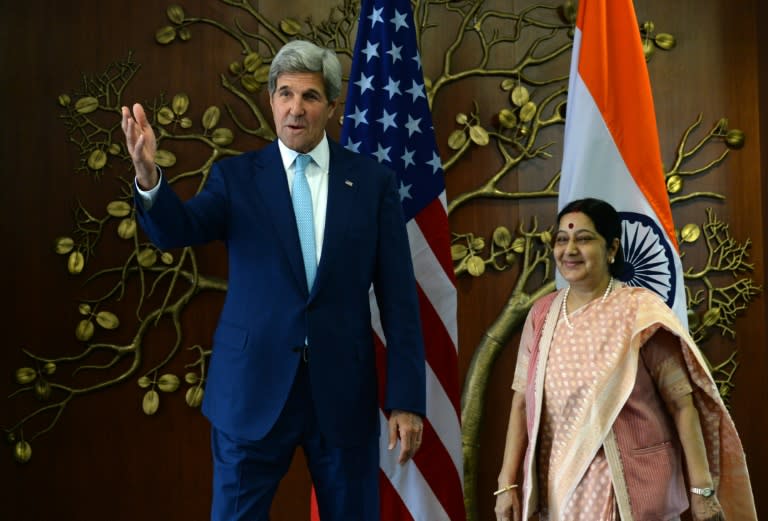 Indian Minister of External Affairs Sushma Swaraj and US Secretary of State John Kerry speak prior to a meeting in New Delhi on August 30, 2016