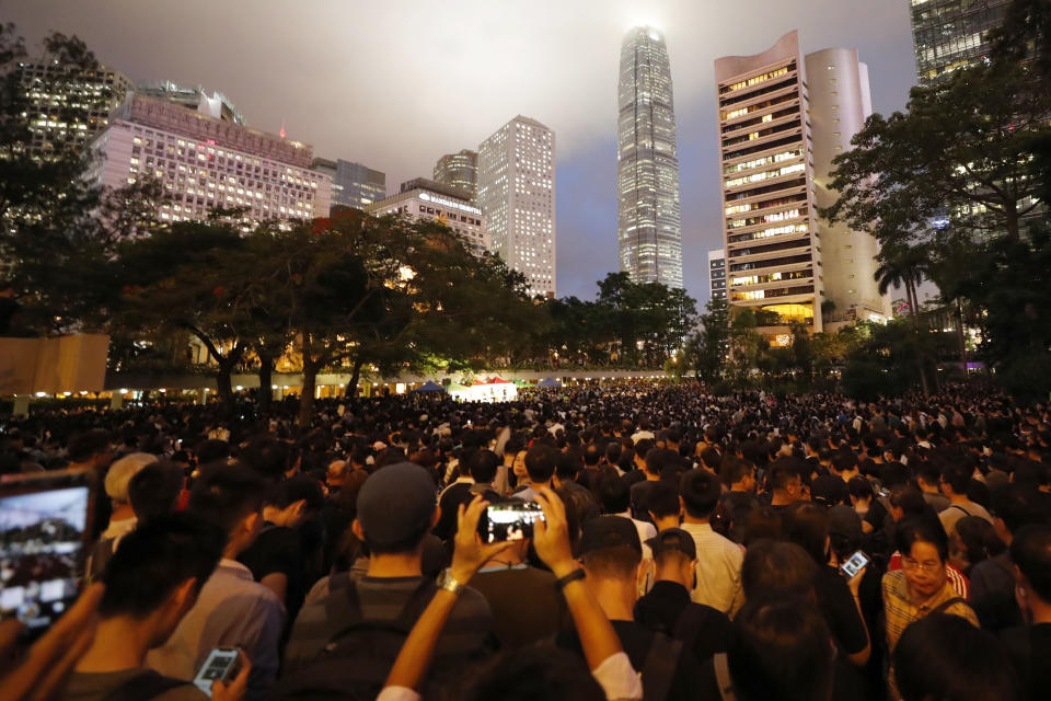 Protesters gather at a demonstration by civil servants in Hong Kong Friday, Aug. 2, 2019. Protesters plan to return to the streets again this weekend, angered by the government's refusal to answer their demands, violent tactics used by police - possibly in coordination with organized crime figures. (AP Photo/Vincent Thian)