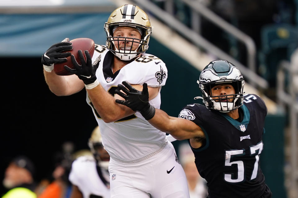 New Orleans Saints' Adam Trautman (82) catches a touchdown pass against Philadelphia Eagles' T.J. Edwards (57) during the first half of an NFL football game, Sunday, Nov. 21, 2021, in Philadelphia. (AP Photo/Derik Hamilton)