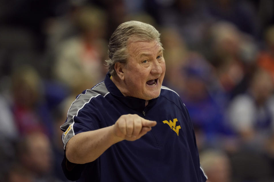 FILE - West Virginia head coach Bob Huggins talks to his players during the first half of an NCAA college basketball game against Texas Tech in the first round of the Big 12 Conference tournament on March 8, 2023, in Kansas City, Mo. Huggins was out of his job following his June arrest on a drunken driving charge. (AP Photo/Charlie Riedel, File)