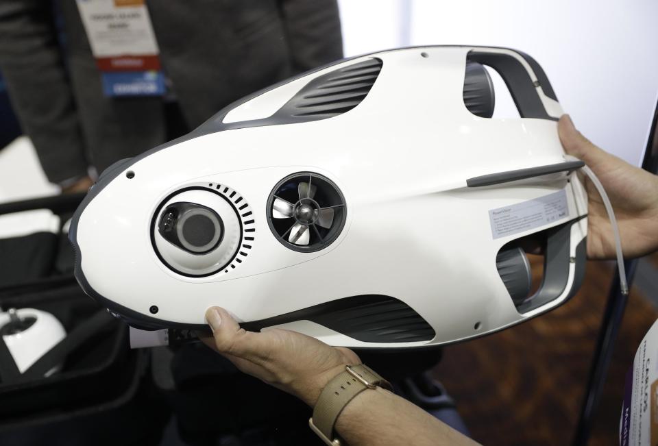 The PowerRay is on display at the Powervision booth during CES Unveiled before CES International, Tuesday, Jan. 3, 2017, in Las Vegas. The underwater drone will detect and take footage of fish. The device can also be controlled by VR goggles. (AP Photo/John Locher)