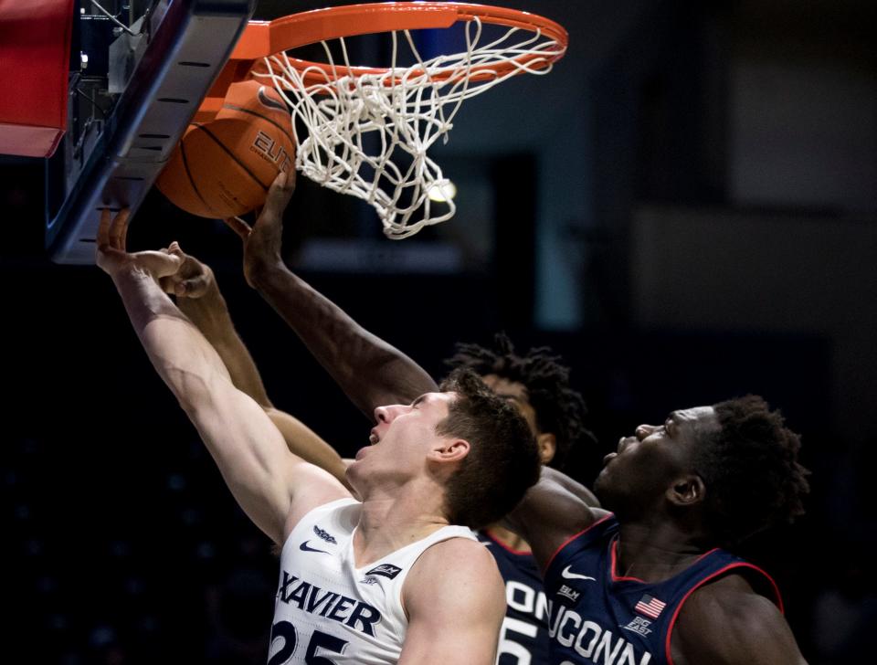 Connecticut forward Adama Sanoga, here blocking a shot against Xavier in a 2021 game, is averaging 17.8 points per game.