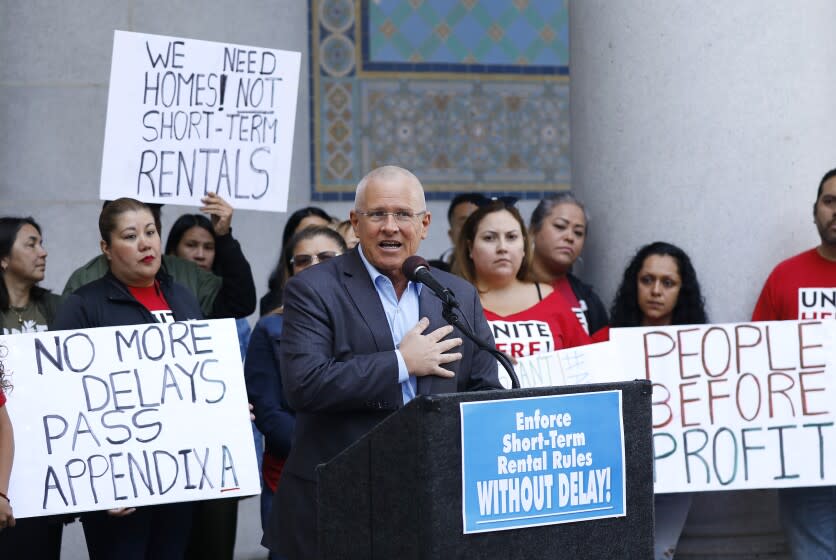 LOS ANGELES, CA - OCTOBER 15, 2019 Los Angeles City Councilman Mike Bonin, center, joined by tenants and community groups critical of Airbnb-type rentals, urged the city to not delay the enforcement of its regulations on renting out homes for short stays at a press conference on Tuesday, Oct. 15 at Los Angeles City Hall. (Al Seib / Los Angeles Times)