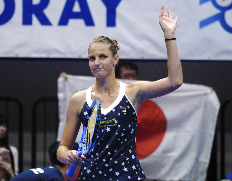 Karolina Pliskova, of Czech Republic celebrates after defeating Naomi Osaka, of Japan at the final match of the Pan Pacific Open women's tennis tournament in Tokyo Sunday, Sept. 23, 2018. (AP Photo/Eugene Hoshiko)